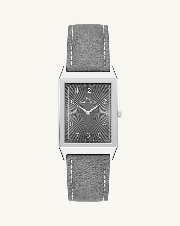 A square mens watch in Rhodium-plated 316L stainless steel from Waldor & Co. with grey guilloche dial. Miyota movement. Leather strap. The model is Conceptual 37 Cap Ferrat.