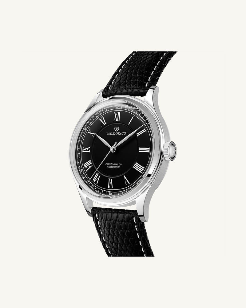 A round Automatic mens watch in Rhodium-plated 316L stainless from Waldor & Co. with black double-layered dial in copper. Curved mineral glass with anti-reflective coating. Miyota 9093 movement. Genuine leather strap. The model is Continual 39 Amalfi.