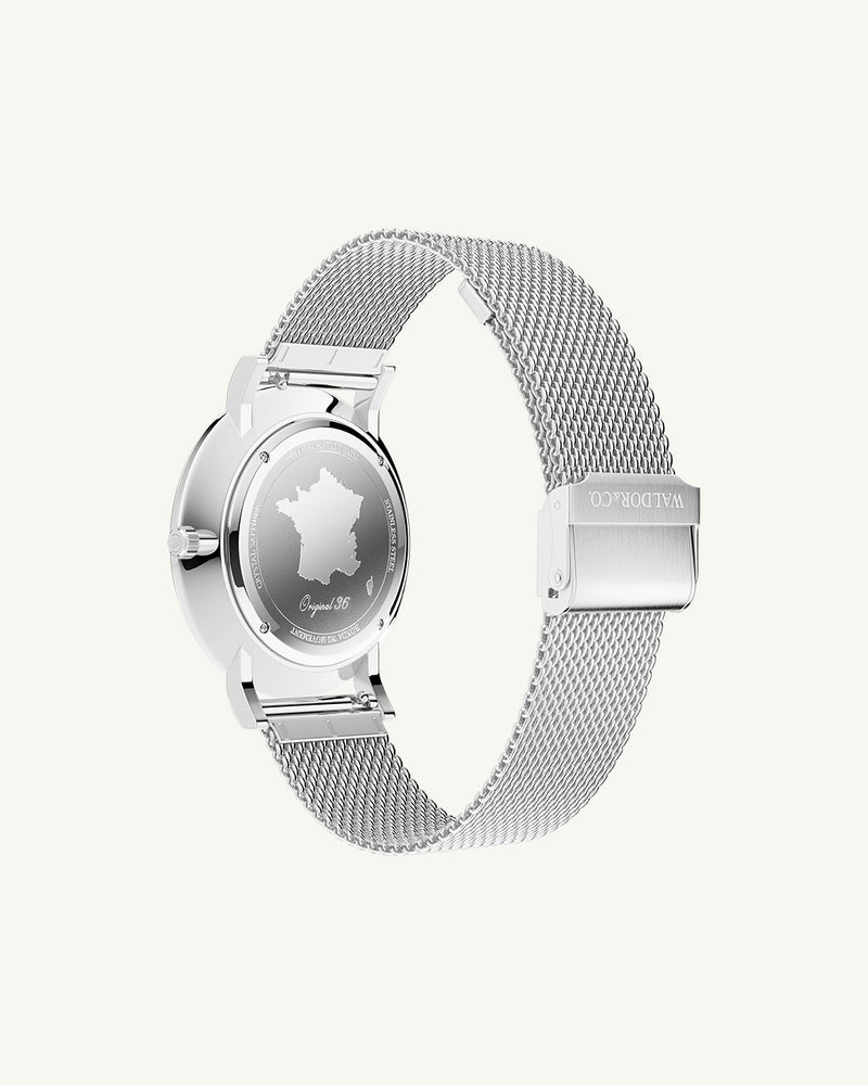 A round watch in silver from Waldor & Co. with black dial. Seiko movement. The model is Original 36 Côte d'Azur 36mm.