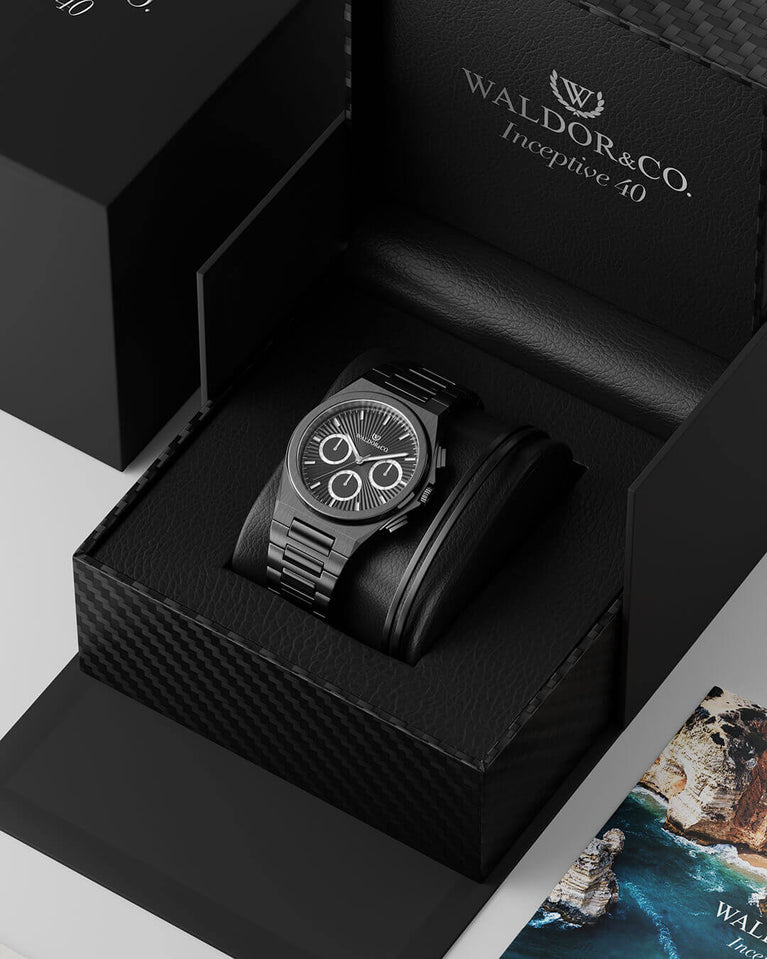 A round mens watch in black Rhodium-plated 316L stainless steel from Waldor & Co. with black sunray dial and luminous hands. Seiko movement. The model is Inceptive 40 Azores.